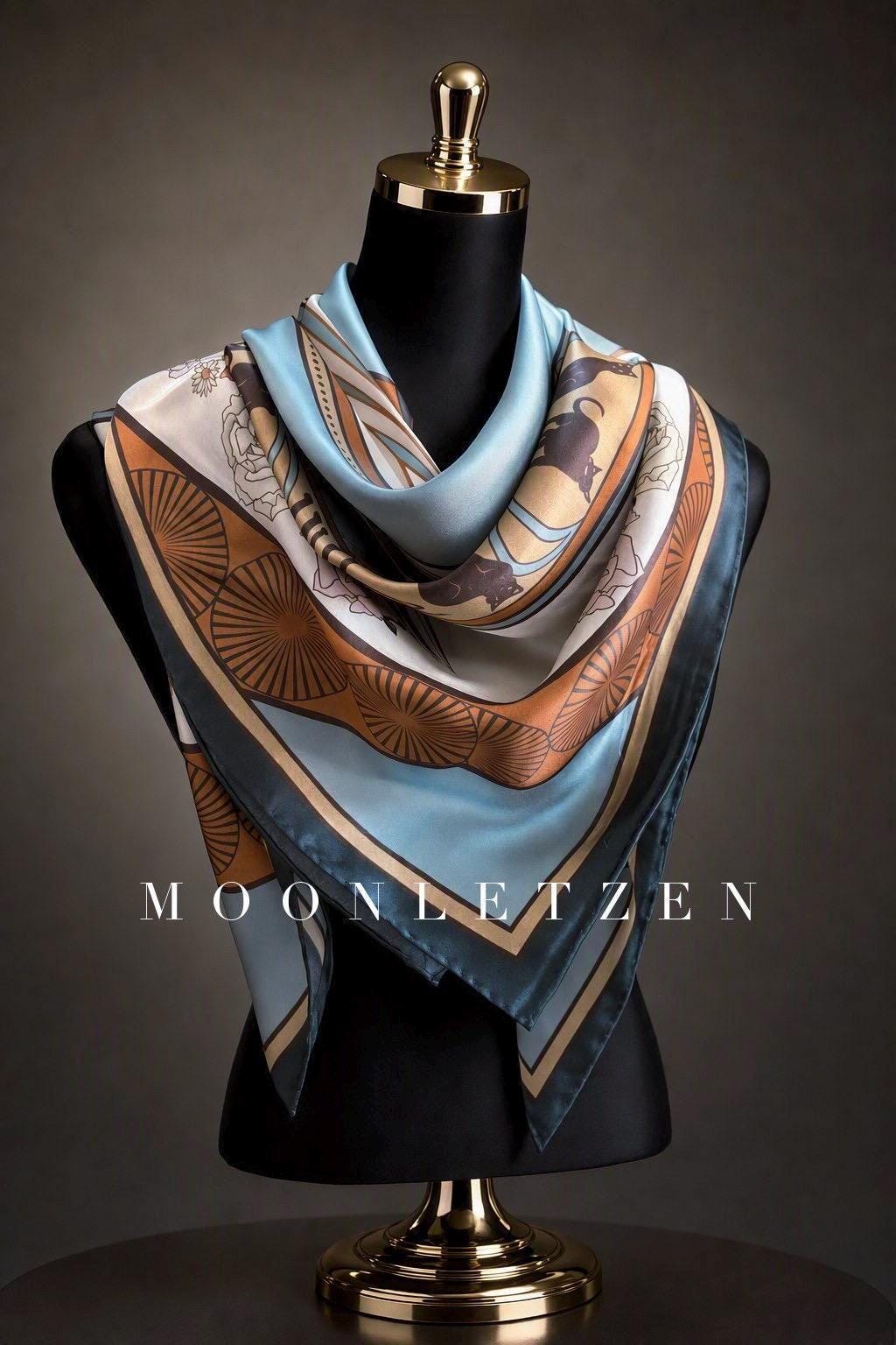 Celadon blue silk square scarf with rosette medallions and amber-gold ornamental borders.