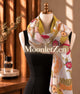 Botanical long silk scarf in olive, chartreuse, blush, ochre and deep red with a chartreuse border.